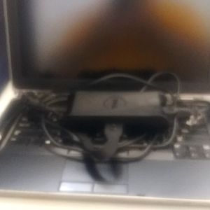 A 2012 Dell Latitude E6430 Notebook, black and gray, 14" inch screen notebook.